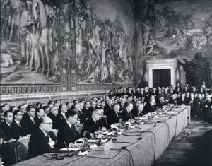 Photo: Signing ceremony of the treaty at the Palazzo dei Conservatori, on Capitoline Hill, Rome. Source: https://en.wikipedia.org/wiki/Treaty_of_Rome#/media/File:Treaty_of_Rome.jpg.