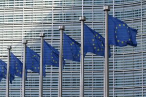 Photo: 'EU flags at the European Commission Berlaymont building,' by Photo by Guillaume Périgois on Unsplash